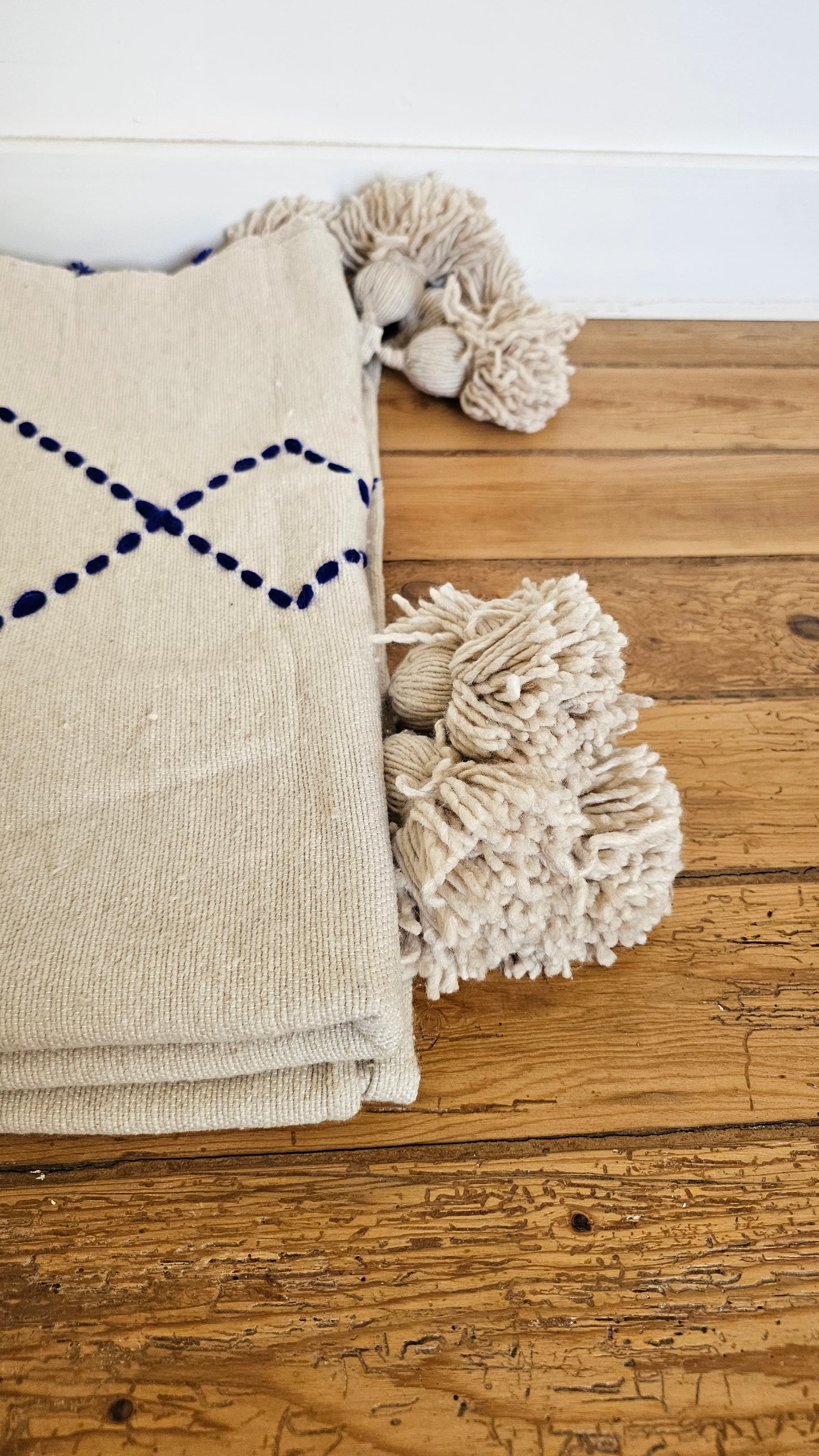 Plaid marocain à pompons